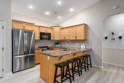 401 Sunvale Crescent Ne, High River, AB - Indoor Photo Showing Kitchen With Double Sink