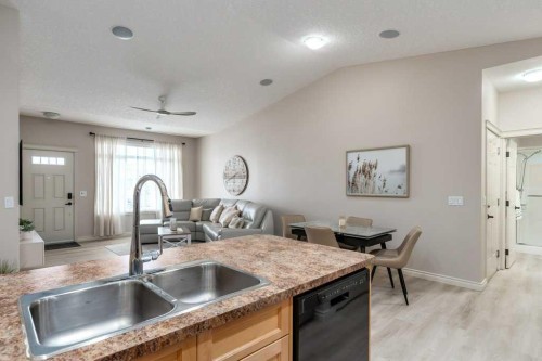 401 Sunvale Crescent Ne, High River, AB - Indoor Photo Showing Kitchen With Double Sink