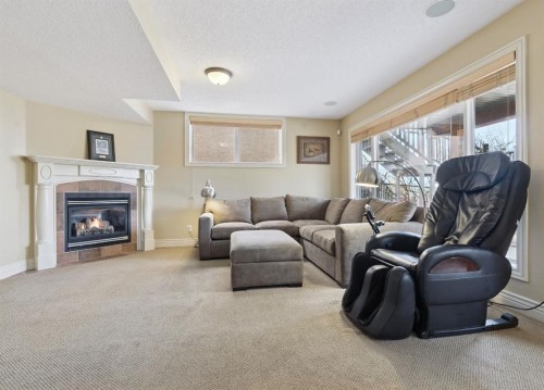 212 Springmere Place, Chestermere, AB - Indoor Photo Showing Living Room With Fireplace