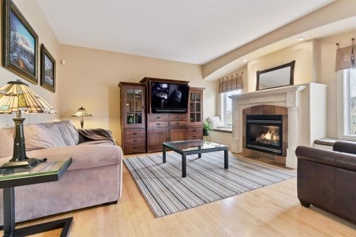 212 Springmere Place, Chestermere, AB - Indoor Photo Showing Living Room With Fireplace