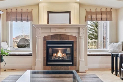212 Springmere Place, Chestermere, AB - Indoor Photo Showing Living Room With Fireplace