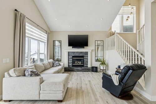 120 Hidden Creek Circle Nw, Calgary, AB - Indoor Photo Showing Living Room With Fireplace
