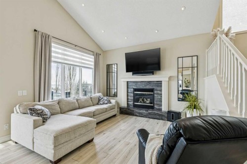 120 Hidden Creek Circle Nw, Calgary, AB - Indoor Photo Showing Living Room With Fireplace