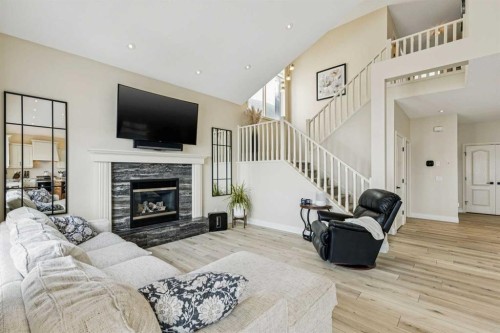 120 Hidden Creek Circle Nw, Calgary, AB - Indoor Photo Showing Living Room With Fireplace