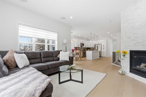 103 Oakmere Green, Chestermere, AB - Indoor Photo Showing Living Room With Fireplace