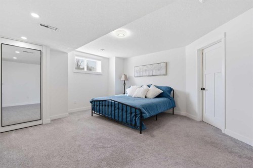 103 Oakmere Green, Chestermere, AB - Indoor Photo Showing Bedroom