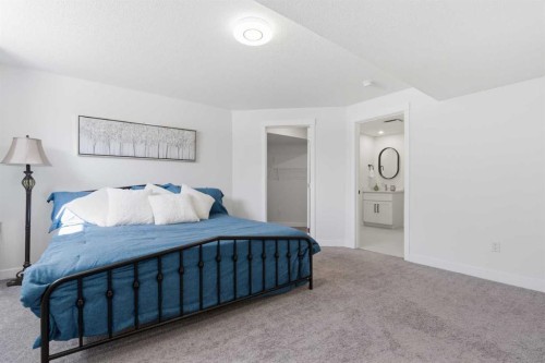 103 Oakmere Green, Chestermere, AB - Indoor Photo Showing Bedroom