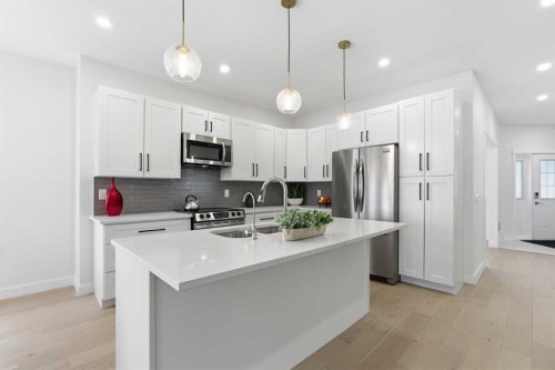 103 Oakmere Green, Chestermere, AB - Indoor Photo Showing Kitchen With Stainless Steel Kitchen With Upgraded Kitchen