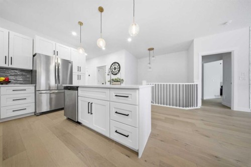 103 Oakmere Green, Chestermere, AB - Indoor Photo Showing Kitchen With Stainless Steel Kitchen With Upgraded Kitchen