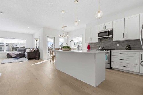 103 Oakmere Green, Chestermere, AB - Indoor Photo Showing Kitchen With Upgraded Kitchen