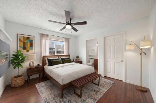 145 Cimarron Grove Circle, Okotoks, AB - Indoor Photo Showing Bedroom