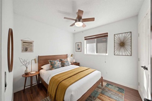 145 Cimarron Grove Circle, Okotoks, AB - Indoor Photo Showing Bedroom