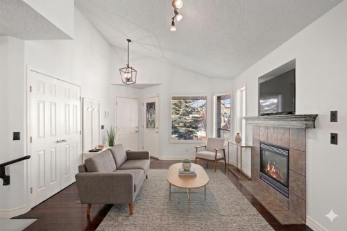 145 Cimarron Grove Circle, Okotoks, AB - Indoor Photo Showing Living Room With Fireplace