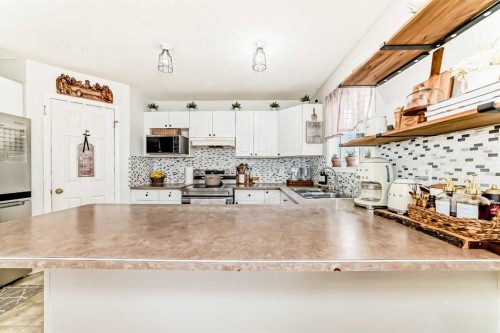 155 Erin Meadow Way Se, Calgary, AB - Indoor Photo Showing Kitchen With Double Sink