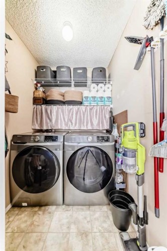 155 Erin Meadow Way Se, Calgary, AB - Indoor Photo Showing Laundry Room