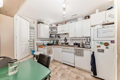 155 Erin Meadow Way Se, Calgary, AB - Indoor Photo Showing Kitchen With Double Sink