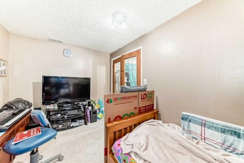 155 Erin Meadow Way Se, Calgary, AB - Indoor Photo Showing Bedroom