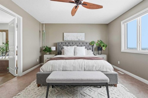 99 Sunset View, Cochrane, AB - Indoor Photo Showing Bedroom