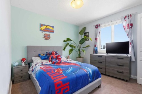 99 Sunset View, Cochrane, AB - Indoor Photo Showing Bedroom