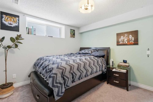 99 Sunset View, Cochrane, AB - Indoor Photo Showing Bedroom