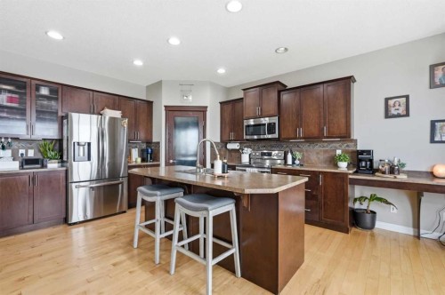 99 Sunset View, Cochrane, AB - Indoor Photo Showing Kitchen With Stainless Steel Kitchen With Double Sink