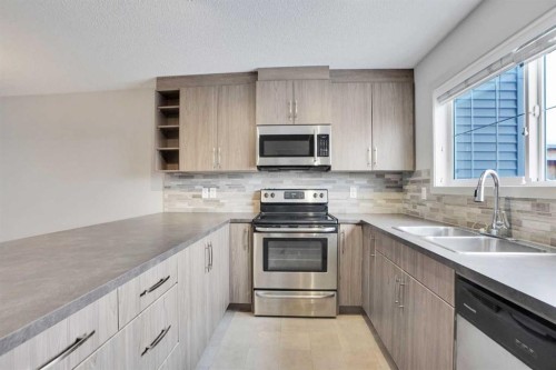 422 Legacy Village Way Se, Calgary, AB - Indoor Photo Showing Kitchen With Stainless Steel Kitchen With Double Sink