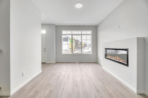 220 Annette Villas Nw, Calgary, AB - Indoor Photo Showing Living Room With Fireplace
