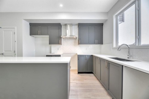220 Annette Villas Nw, Calgary, AB - Indoor Photo Showing Kitchen With Double Sink