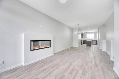 220 Annette Villas Nw, Calgary, AB - Indoor Photo Showing Other Room With Fireplace