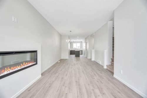 220 Annette Villas Nw, Calgary, AB - Indoor With Fireplace