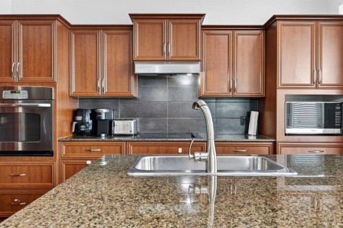 38 Silverado Skies Crescent, Calgary, AB - Indoor Photo Showing Kitchen With Double Sink