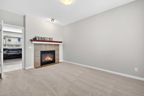 38 Silverado Skies Crescent, Calgary, AB - Indoor Photo Showing Other Room With Fireplace