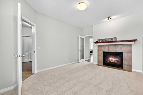 38 Silverado Skies Crescent, Calgary, AB - Indoor Photo Showing Living Room With Fireplace