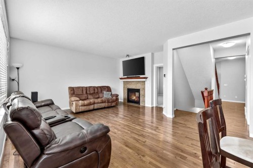 38 Silverado Skies Crescent, Calgary, AB - Indoor Photo Showing Living Room With Fireplace