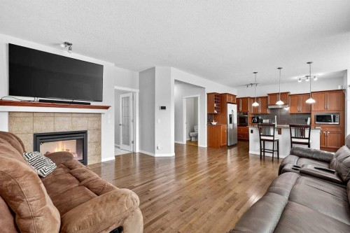 38 Silverado Skies Crescent, Calgary, AB - Indoor Photo Showing Living Room With Fireplace