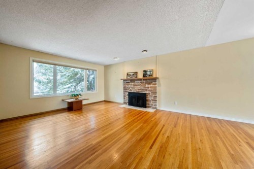 3316 24 Street Nw, Calgary, AB - Indoor Photo Showing Living Room With Fireplace