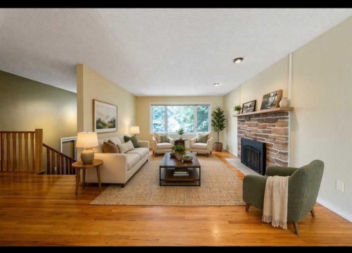 3316 24 Street Nw, Calgary, AB - Indoor Photo Showing Living Room With Fireplace