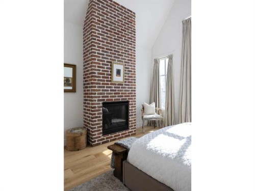 2028 41 Avenue Sw, Calgary, AB - Indoor Photo Showing Bedroom With Fireplace