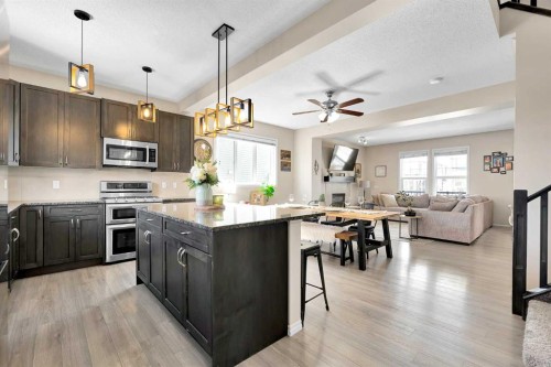 151 Heritage Drive, Cochrane, AB - Indoor Photo Showing Kitchen With Stainless Steel Kitchen With Upgraded Kitchen