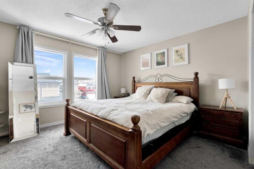 151 Heritage Drive, Cochrane, AB - Indoor Photo Showing Bedroom