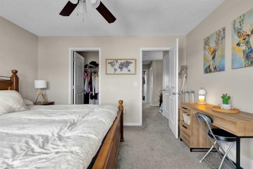 151 Heritage Drive, Cochrane, AB - Indoor Photo Showing Bedroom