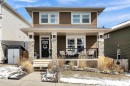 151 Heritage Drive, Cochrane, AB  - Outdoor With Deck Patio Veranda With Facade 