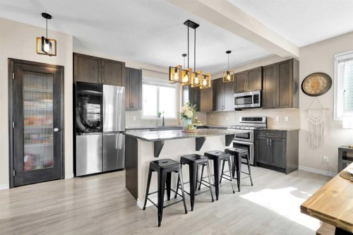 151 Heritage Drive, Cochrane, AB - Indoor Photo Showing Kitchen With Stainless Steel Kitchen With Upgraded Kitchen
