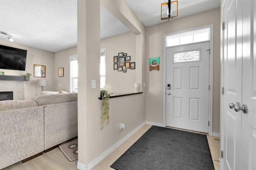 151 Heritage Drive, Cochrane, AB - Indoor Photo Showing Other Room With Fireplace