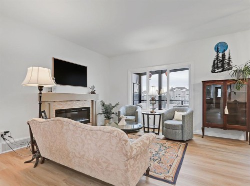 1627 Montrose Terrace Se, High River, AB - Indoor Photo Showing Living Room With Fireplace