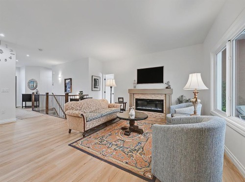 1627 Montrose Terrace Se, High River, AB - Indoor Photo Showing Living Room With Fireplace