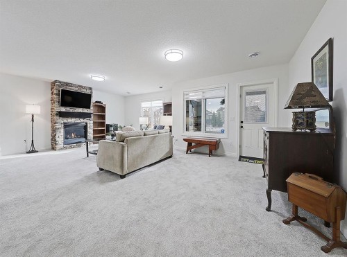 1627 Montrose Terrace Se, High River, AB - Indoor Photo Showing Living Room With Fireplace