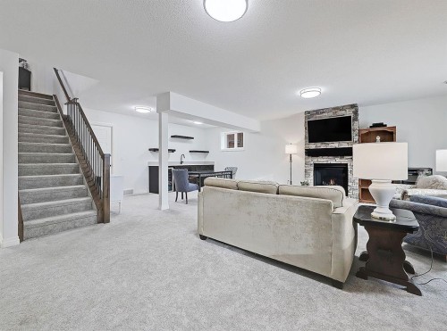 1627 Montrose Terrace Se, High River, AB - Indoor Photo Showing Other Room With Fireplace