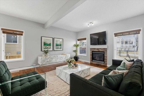 34 Everoak Gardens Sw, Calgary, AB - Indoor Photo Showing Living Room With Fireplace