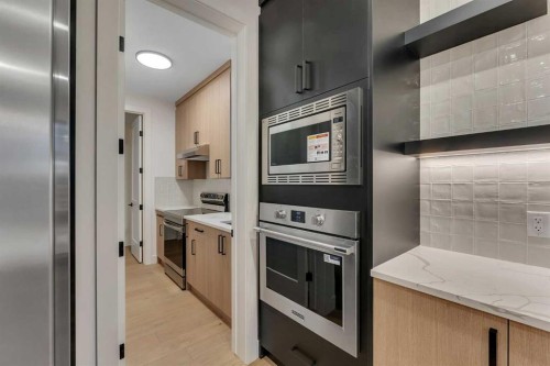 153 Waterford Passage, Chestermere, AB - Indoor Photo Showing Kitchen